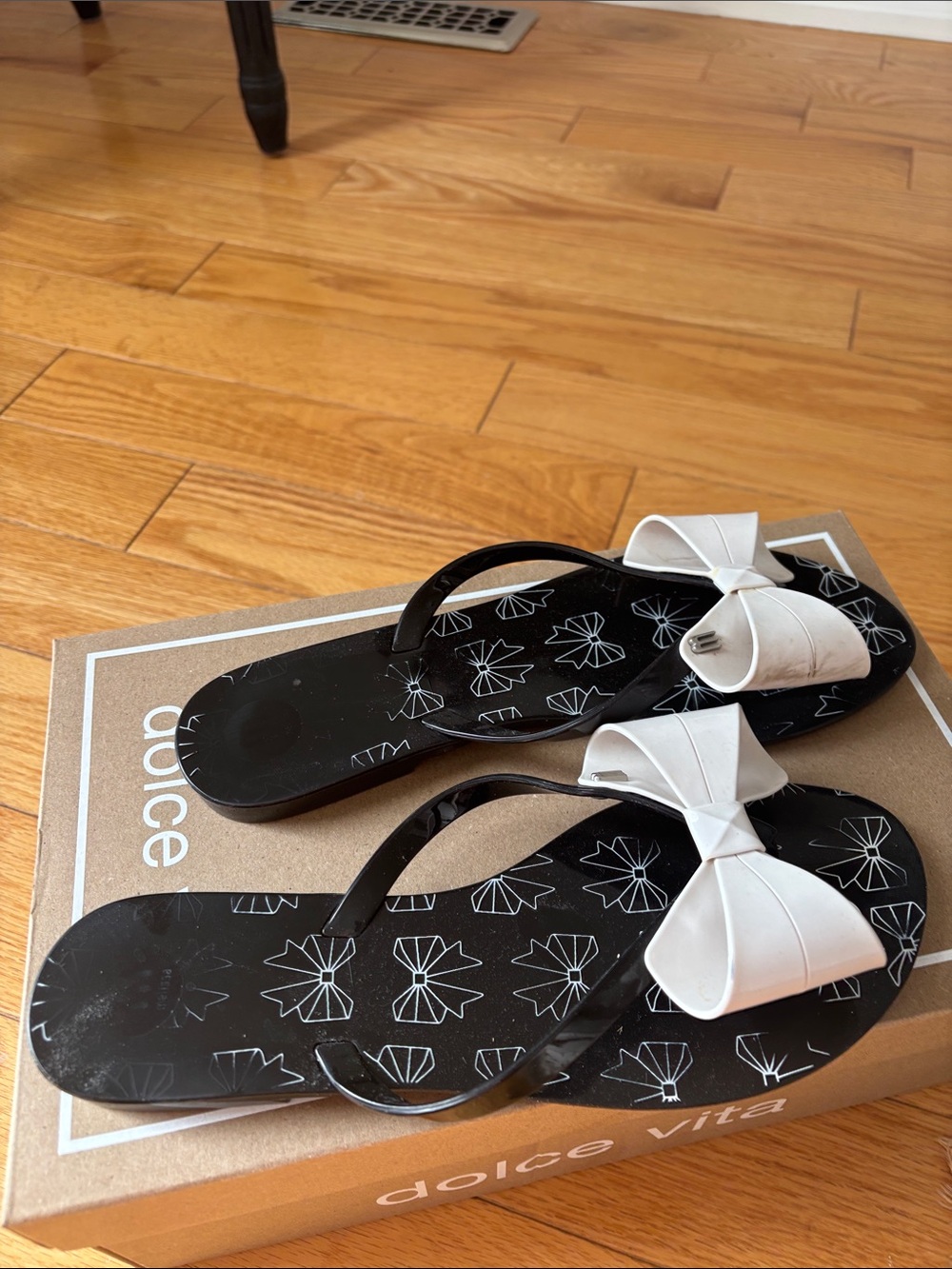 Dolce Vita Black Flip-Flop Sandals with White Bow Accent